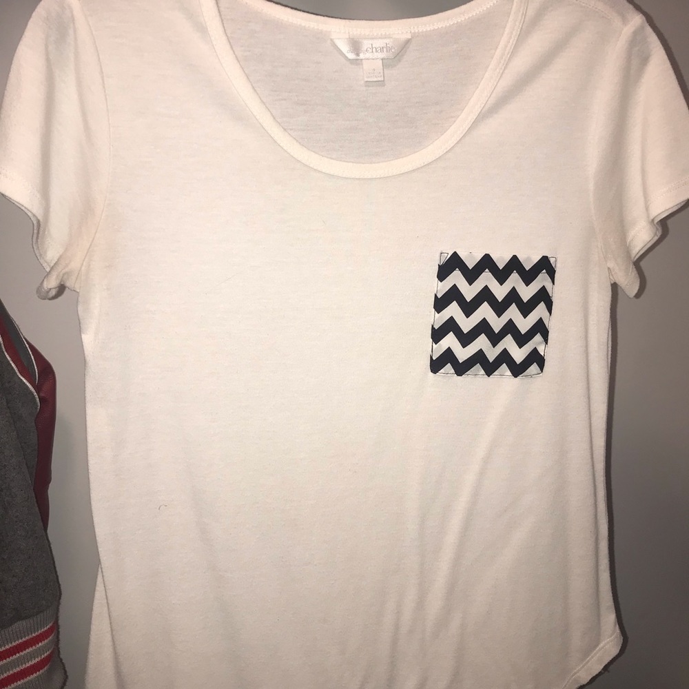 White shirt with black and white chevron pocket